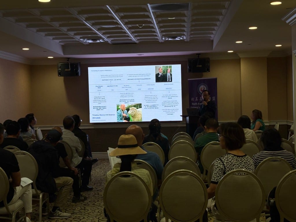 Dr. Dustin Zhi Zeng presenting a longevity science timeline to the audience